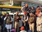 Police officials trying to pacify the protesters at Thikriwala village of Barnala district on Wednesday. (HT Photo)