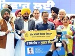 Punjab chief minister Bhagwant Mann and AAP national convener Arvind Kejriwal during the launch of the Mukh Mantri Sehat Yojana in Mohali on Thursday. (@msisodiaX)