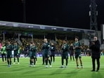 Manchester City players and coach Pep Guardiola applaud the away fans in Norway.