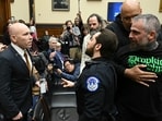A US Capitol Police officer intervenes as far-right political operative Ivan Raiklin (L) confronts former Metropolitan Police Department officer Michael Fanone (R) held by Former US Capitol Police Officer Harry Dunn (2R), during a break in testimony by former US special counsel Jack Smith before the House Judiciary Committee on Capitol Hill in Washington, DC. A US Capitol Police officer intervenes as far-right political operative Ivan Raiklin (L) confronts former Metropolitan Police Department officer Michael Fanone (R) held by Former US Capitol Police Officer Harry Dunn (2R), during a break in testimony by former US special counsel Jack Smith before the House Judiciary Committee on Capitol Hill in Washington, DC.