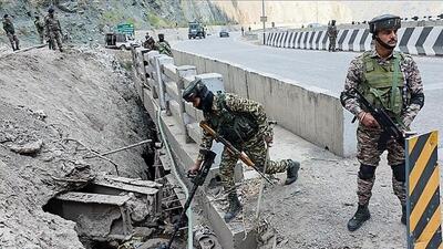 Central Reserve Police Force personnel keeping vigil on the Jammu-Srinagar National Highway (NH-44) in Ramban on Thursday ahead of the 77th Republic Day. (ANI)