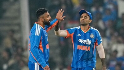 India's Varun Chakravarthy, left, with captain Suryakumar Yadav celebrates after taking a wicket. (PTI) India's Varun Chakravarthy, left, with captain Suryakumar Yadav celebrates after taking a wicket. (PTI)