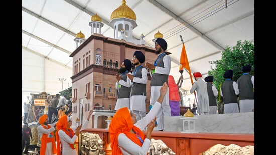 The tableau consists of a tractor and a trailer. The tractor portion has a hand symbol exuding a spiritual aura, signifying a humanitarian and compassionate approach. (HT)