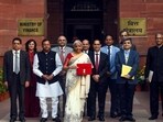 Nirmala Sitharaman with the budget tab at the ministry before heading to Parliament in 2025.