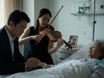Chinese son quit his job to care for his ailing mother and arranged a violin performance in hospital.