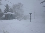 Strong winds kick up snow in Lowville, New York, on Friday.