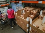 A shopper loads a case of eggs into their cart on January 23, 2026 in Lenexa, Kansas. A massive winter storm is bringing frigid temperatures, ice, and snow to millions of Americans across the nation.