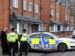 Police attend the scene after two men were injured, hit by a car outside a mosque, in Birmingham, England, Friday April 27, 2018. Police in the central England city are trying to trace the driver of a silver car that fled the scene.