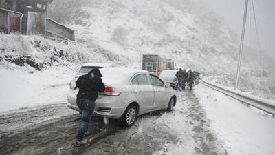 A commuter struggling to negotiate a slippery stretch after heavy snowfall in Shimla on Friday. (Deepak Sansta/HT) A commuter struggling to negotiate a slippery stretch after heavy snowfall in Shimla on Friday. (Deepak Sansta/HT)