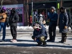 A person kneels near the site where 37-year-old Alex Pretti was allegedly shot and killed by federal agents A person kneels near the site where 37-year-old Alex Pretti was allegedly shot and killed by federal agents