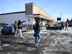 Border Patrol agents are confronted by observers in the parking lot of the Asian grocery store Dragon Star Oriental Foods 