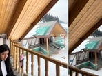 The woman attended the call from a balcony against a snow-covered background.