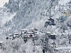 Houses and mountains covered with snow after fresh snowfall, in Doda district of Jammu and Kashmir.