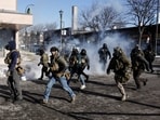 Minneapolis shooting update: Federal agents amid tear gas at the scene where federal agents fatally shot a man while trying to detain him, in Minneapolis, Minnesota, U.S., January 24, 2026. REUTERS/Tim Evans