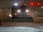 A vehicle equipped with a snowplow clears snow as Winter Storm Fern arrives in Oklahoma City, Oklahoma, U.S., January 23, 2026.