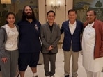 Radhika Merchant and Anant Ambani with Mukesh Ambani in Jamnagar. 