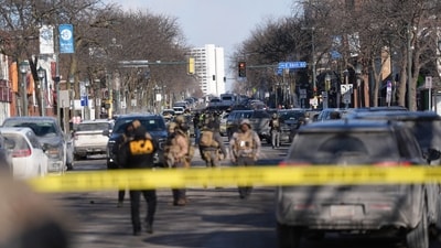 Federal agents stand near the site of a shooting Saturday, Jan. 24, 2026, in Minneapolis. (AP Photo/Abbie Parr) (AP) Federal agents stand near the site of a shooting Saturday, Jan. 24, 2026, in Minneapolis. (AP Photo/Abbie Parr) (AP)