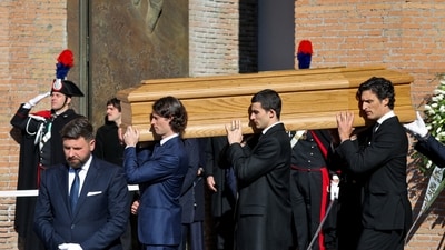 Anthony Souza, the godson of late fashion designer Valentino Garavani, and pallbearers carry the coffin of Valentino Garavani, who died at the age of 93, outside the Basilica of Saint Mary of the Angels and Martyrs, during the funeral ceremony.&nbsp; (REUTERS)