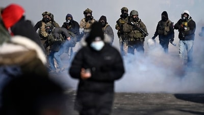 Protestors retreat after federal agents fire tear gas on January 24, 2026 in Minneapolis, Minnesota. Protestors gathered after after a protestor was shot and killed amid a scuffle to arrest him. (Getty Images via AFP) Protestors retreat after federal agents fire tear gas on January 24, 2026 in Minneapolis, Minnesota. Protestors gathered after after a protestor was shot and killed amid a scuffle to arrest him. (Getty Images via AFP)