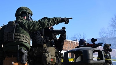 Federal agents point weapons at protestors after agents allegedly shot a protestor amid a scuffle to arrest him on January 24, 2026 in Minneapolis, Minnesota. (Getty Images via AFP) Federal agents point weapons at protestors after agents allegedly shot a protestor amid a scuffle to arrest him on January 24, 2026 in Minneapolis, Minnesota. (Getty Images via AFP)
