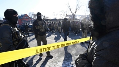 Federal agents block off the scene of a shooting as crowds gather on January 24, 2026 in Minneapolis, Minnesota. (Getty Images via AFP) Federal agents block off the scene of a shooting as crowds gather on January 24, 2026 in Minneapolis, Minnesota. (Getty Images via AFP)
