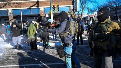 Fedearl agents respond as demonstators gather near the site of where state and local authorities say a man was shot by federal agents earlier in the morning in Minneapolis, Minnesota, on January 24, 2026. Minnesota Governor Tim Walz said Saturday that federal agents deployed in Minneapolis as part of a sweeping immigration crackdown had carried out "another horrific shooting," less than three weeks after the fatal shooting of Renee Good. (Photo by ROBERTO SCHMIDT / AFP) (AFP) Fedearl agents respond as demonstators gather near the site of where state and local authorities say a man was shot by federal agents earlier in the morning in Minneapolis, Minnesota, on January 24, 2026. Minnesota Governor Tim Walz said Saturday that federal agents deployed in Minneapolis as part of a sweeping immigration crackdown had carried out "another horrific shooting," less than three weeks after the fatal shooting of Renee Good. (Photo by ROBERTO SCHMIDT / AFP) (AFP)