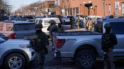 Federal agents stand guard at the scene of a shooting involving federal immigration agents, in Whittier neighborhood, in South Minneapolis, Minnesota, U.S., January 24, 2026. REUTERS/Seth Herald (REUTERS)