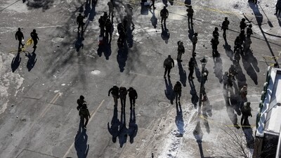 Federal agents at the scene of a shooting involving federal immigration agents in Minneapolis, Minnesota, U.S., January 24, 2026. REUTERS/Tim Evans (REUTERS)