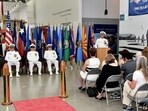 Capt. Douglas Whimpey delivers remarks as the guest speaker during Naval Construction Battalion (NCB) 22’s Change of Command