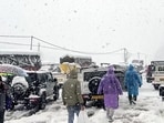 Manali, Jan 24 (ANI): People make their way on a snow-covered road as vehicles are stuck in a traffic jam amid snowfall, in Manali on Friday. (ANI Video Grab) Manali, Jan 24 (ANI): People make their way on a snow-covered road as vehicles are stuck in a traffic jam amid snowfall, in Manali on Friday. (ANI Video Grab)