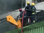 Rescue operations underway after a fire broke out in a furniture godown at Nampally, in Hyderabad on Saturday. (ANI) Rescue operations underway after a fire broke out in a furniture godown at Nampally, in Hyderabad on Saturday. (ANI)