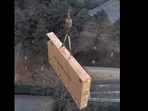 A Chinese man’s 110 inch television was delivered by crane due to its massive size.