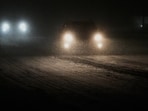 People drive on a snow-covered street in Glenview, Illinois. (Representational)