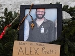 A picture of Alex Pretti is left at a makeshift memorial in the area where Pretti was shot dead 