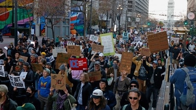 Demonstrators carry out an anti-ICE protest march across San Francisco's Market Street after an anti-immigration protester was shot dead by federal agents in Minneapolis on Saturday. (Stephen Lam/AP) Demonstrators carry out an anti-ICE protest march across San Francisco's Market Street after an anti-immigration protester was shot dead by federal agents in Minneapolis on Saturday. (Stephen Lam/AP)