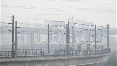 DMRC said fog lights, reflective tapes on helmets and high-visibility jackets are being used during night and fog-prone hours. (HT Photo) DMRC said fog lights, reflective tapes on helmets and high-visibility jackets are being used during night and fog-prone hours. (HT Photo)
