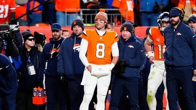 Denver Broncos quarterback Jarrett Stidham (8) stands next to quarterback Bo Nix (10) during overtime of an AFC Divisional Round playoff game against the Buffalo Bills at Empower Field at Mile High. (IMAGN IMAGES via Reuters Connect)