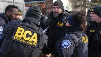 A Minneapolis man claims federal agents forcibly removed him from his vehicle and detained him for eight hours without charges. (AP Photo/Adam Gray) (AP) A Minneapolis man claims federal agents forcibly removed him from his vehicle and detained him for eight hours without charges. (AP Photo/Adam Gray) (AP)