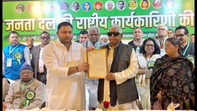 Newly appointed RJD national president Tejashwi Yadav receiving certificate from RJD chief Lalu Prasad during the party’s national executive meeting at Hotel Maurya in Patna on Sunday. (Santosh Kumar/HT) Newly appointed RJD national president Tejashwi Yadav receiving certificate from RJD chief Lalu Prasad during the party’s national executive meeting at Hotel Maurya in Patna on Sunday. (Santosh Kumar/HT)