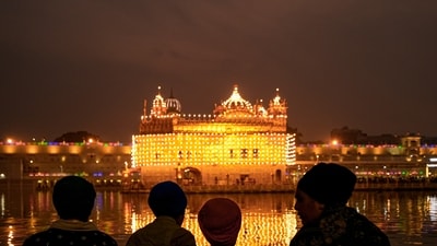 In the alleged video, Rangrez is seen allegedly sitting near the sacred sarovar with his feet in the water, rinsing his mouth and spitting the water back into the sarovar. (PTI) In the alleged video, Rangrez is seen allegedly sitting near the sacred sarovar with his feet in the water, rinsing his mouth and spitting the water back into the sarovar. (PTI)