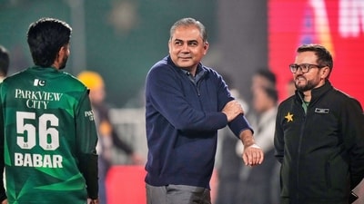 Chairman of Pakistan Cricket Board Mohsin Naqvi, centre, chats with Pakistan's Babar Azam, left, as head coach Mike Hesson watches. (AP)