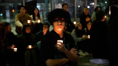 Demonstrators hold a candlelight vigil during a protest in Los Angeles after ICE agents shot dead a protester in Minneapolis on Saturday. (Caroline Brehman/AP) Demonstrators hold a candlelight vigil during a protest in Los Angeles after ICE agents shot dead a protester in Minneapolis on Saturday. (Caroline Brehman/AP)