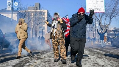 As ICE agents approach, anti-immigration protest demonstrators recede during in Minneapolis after federal agents shot and killed a 37-year-old man amid a scuffle to arrest him in the region on Saturday. (Brandon Bell/AFP) As ICE agents approach, anti-immigration protest demonstrators recede during in Minneapolis after federal agents shot and killed a 37-year-old man amid a scuffle to arrest him in the region on Saturday. (Brandon Bell/AFP)