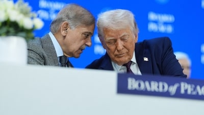 President Donald Trump, right, speaks with Shehbaz Sharif, Prime Minister of Pakistan, during a signing of the 'Board of Peace' charter during the World Economic Forum in Davos, Switzerland, on Thursday, January 22, 2026. (AP Photo)