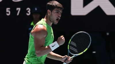 Carlos Alcaraz reacts after a point against USA's Tommy Paul during their men's singles match on day eight of the Australian Open. (AFP) Carlos Alcaraz reacts after a point against USA's Tommy Paul during their men's singles match on day eight of the Australian Open. (AFP)