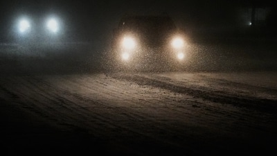 People drive on a snow-covered street in Glenview, Illinois. (Representational) (AP) People drive on a snow-covered street in Glenview, Illinois. (Representational) (AP)