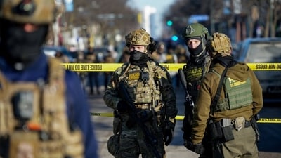 Federal agents at the scene of the shooting in Minneapolis on Saturday. Federal agents at the scene of the shooting in Minneapolis on Saturday.