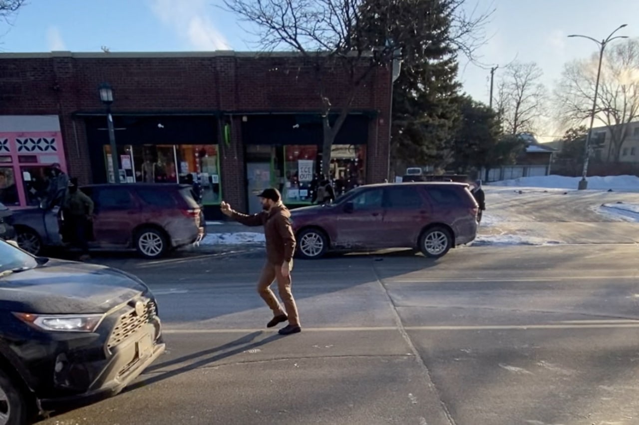 An image from a video showed Alex Pretti using a mobile phone moments before he was fatally shot in Minneapolis on Saturday. An image from a video showed Alex Pretti using a mobile phone moments before he was fatally shot in Minneapolis on Saturday.
