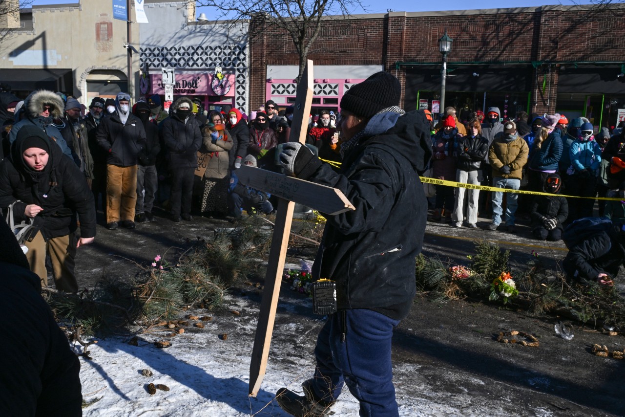 A wooden cross was placed at a makeshift memorial in Minneapolis on Saturday. A wooden cross was placed at a makeshift memorial in Minneapolis on Saturday.