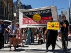 Demonstrators take part in the annual "Invasion Day" rally in Melbourne on Australia Day.
